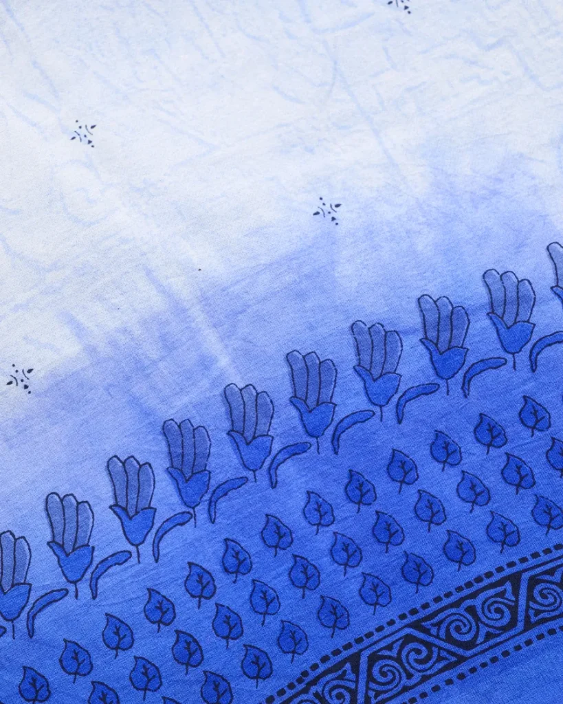 Blue block-printed cotton fabric with a floral border